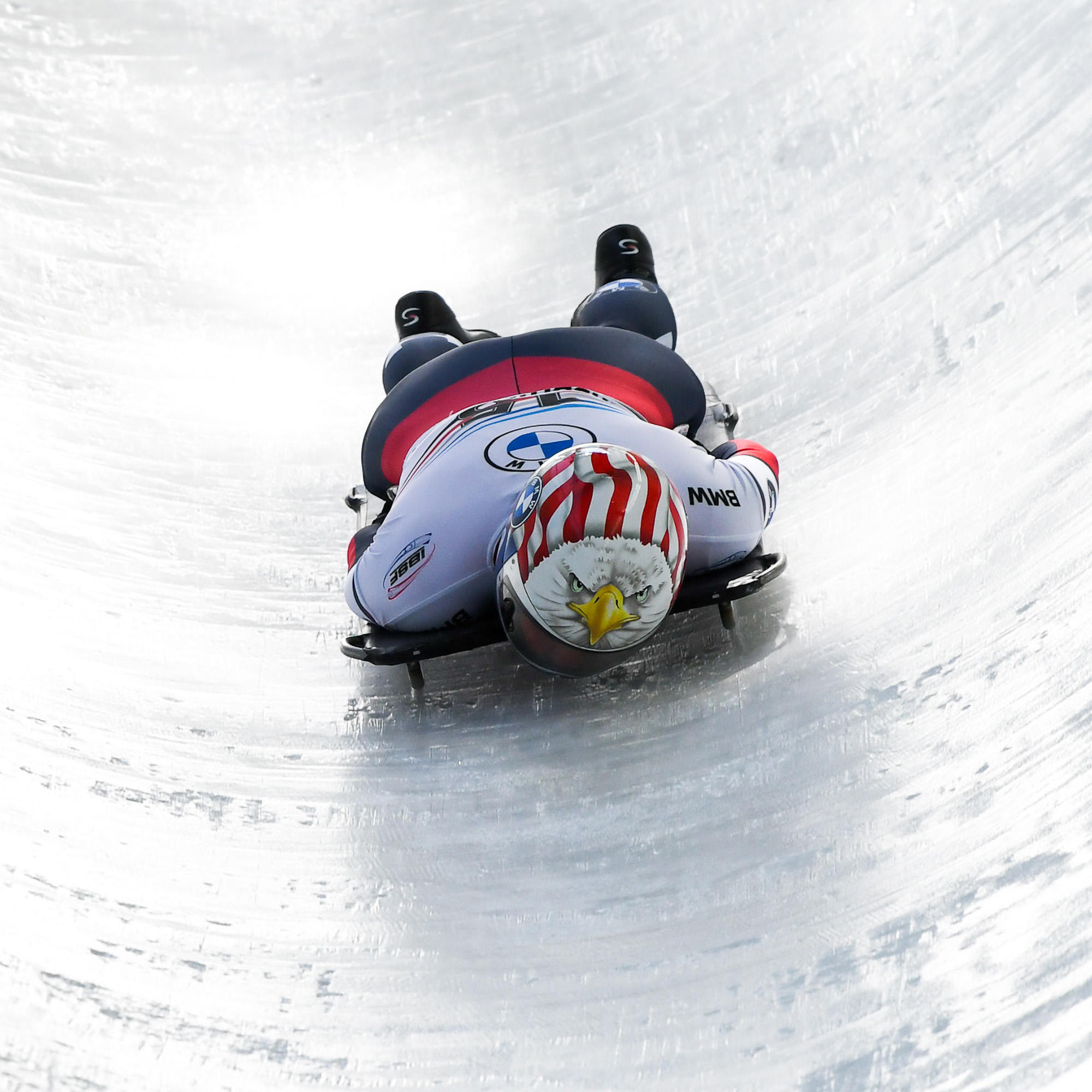Olympic skeleton athlete Katie Uhlaender racing headfirst on an ice track